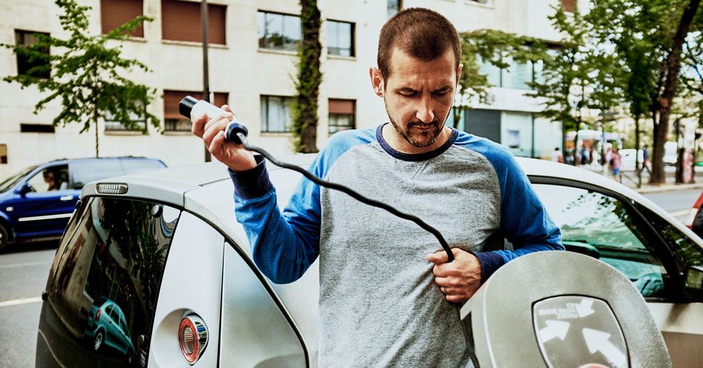 Man-at-e-vehicle-charging-station.jpg