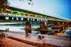 Large_MS PPT_Web-People walking and cycling on the boulevard next to a river and bridge in warsaw, poland..jpg