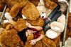 Large_MS PPT_Web-Overhead view of teenage girl laying in middle of a teddy bear pile.jpg