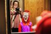 Large_Web and Screen-Boy with silly glasses looking in a mirror and laughs very hard while his mom stands behind him taking his photo.jpg